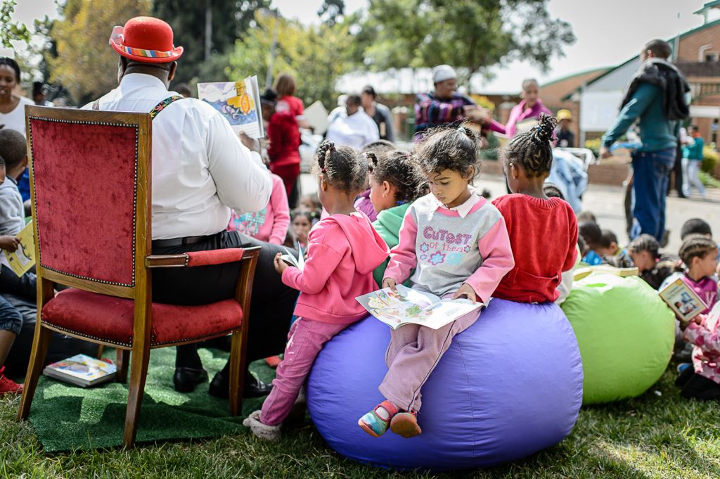 NT18MNlibraryChildren-enjoying-a-good-story-at-the-Readathon-pop-up-library.jpg